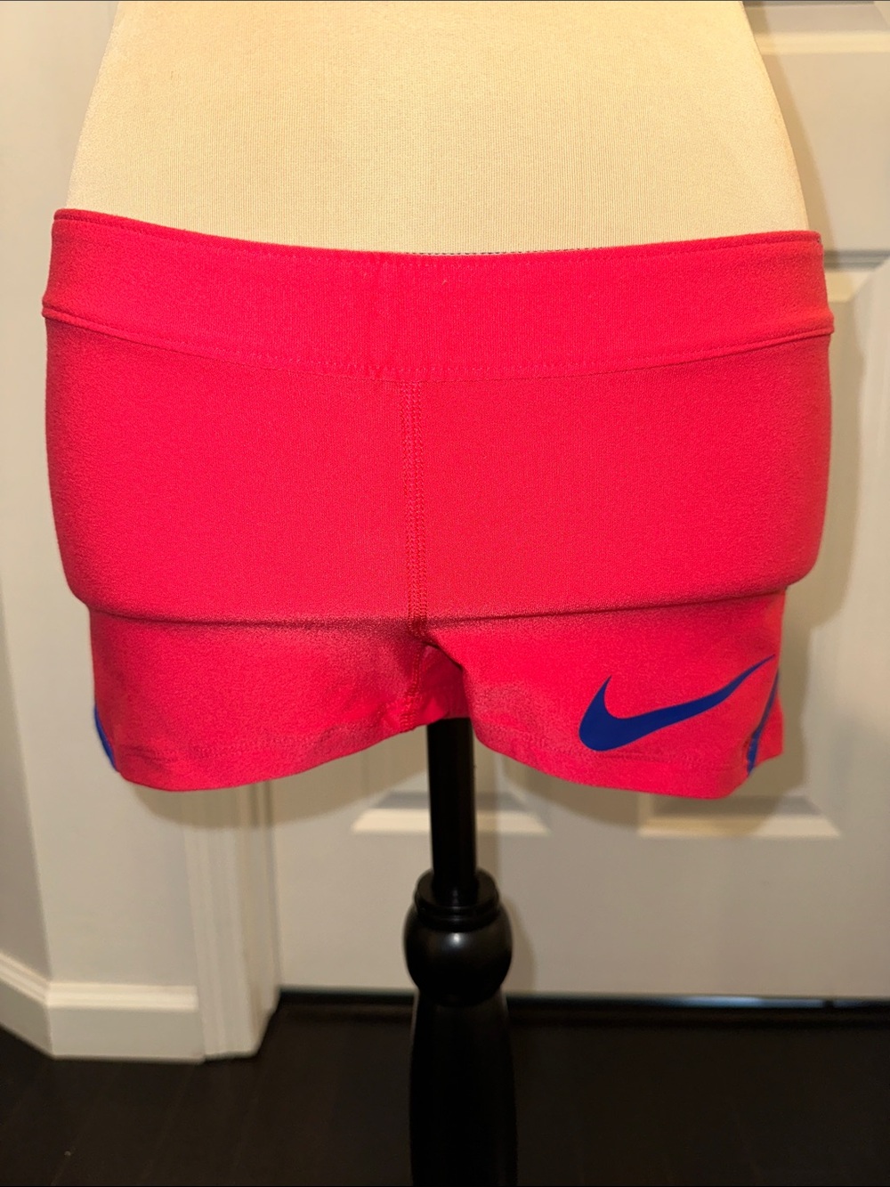 Nike Women’s Hot Pink Athletic Shorts with Blue Swoosh